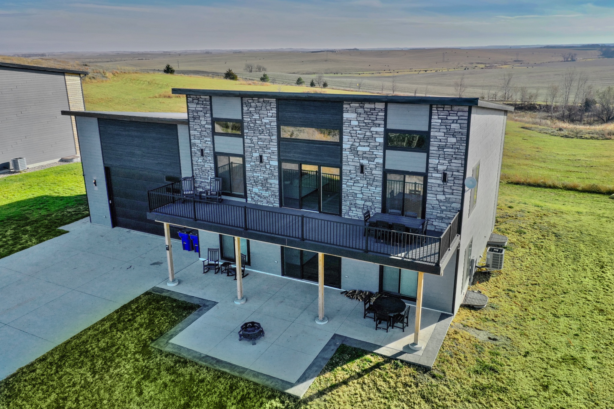 Aerial of the back of the house and deck
